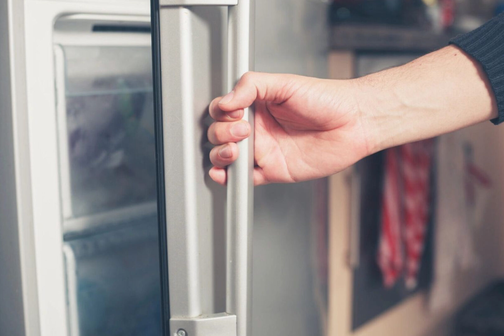 A person opening the door of an oven.